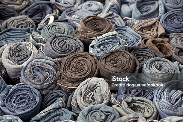 A Large Number Of Blue Jeans That Are Rolled Up Side By Side Stock Photo - Download Image Now