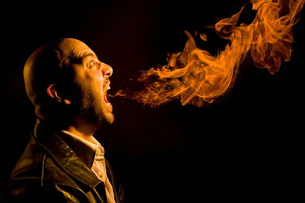 Photo of Man Breathing Fire - Heartburn, Bad Breath, or Anger