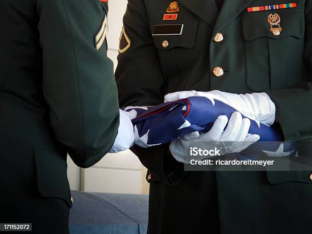 Military Honor Guard Folds United States Flag At Veteran Funeral Stock Photo - Download Image Now