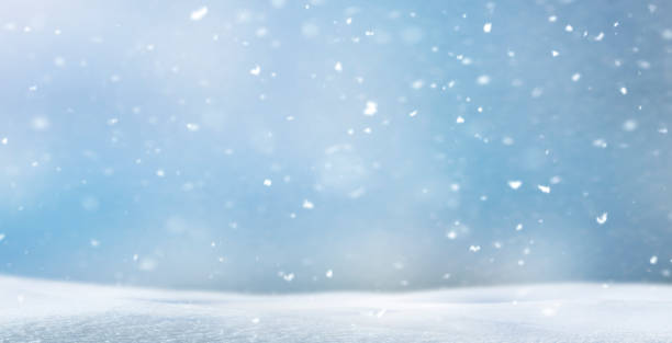 istock Blurred winter background with snowflakes 1711521622