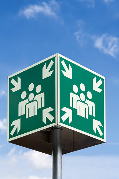 istock Meeting or evacuation point sign against blue sky 171152646