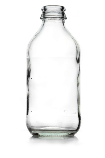 Empty old green glass bottle, seen from beneath. Vintage, retro.