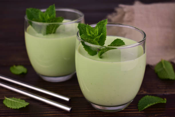 istock Mint milkshake on a dark wooden table. Foreground. 1711529421