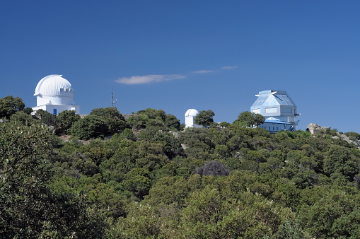 Three of the many observatories at the  Kitt Peak National Observatory site near Tucson, Arizona.
