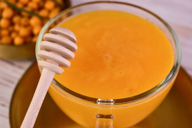 istock Tea from sea buckthorn berries in a cup. Close-up. 1711529975