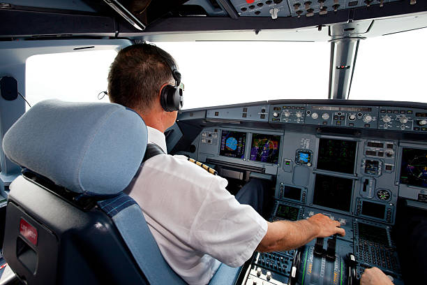 istock Senior pilot in the cockpit during a commercial flight 171153133