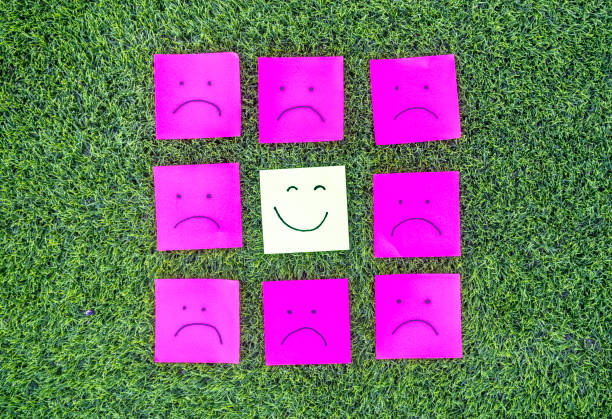 Blank pink post-it note isolated on white