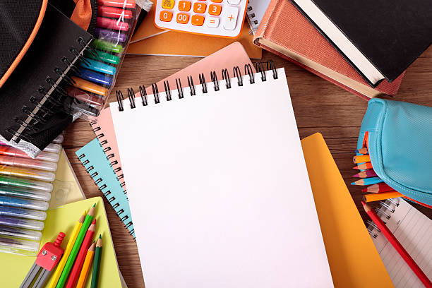 istock Busy student's desk with blank sketch pad 171153371