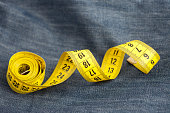 Measure tape on jeans