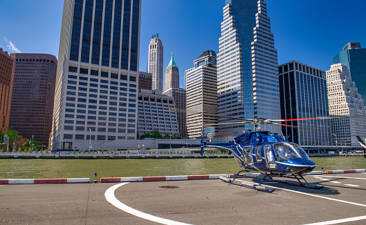 White helicopter with working propeller, isolated on white