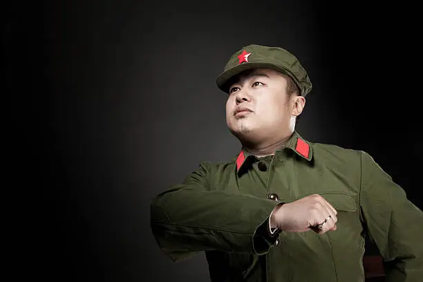Chinese soldier. Gray background. 