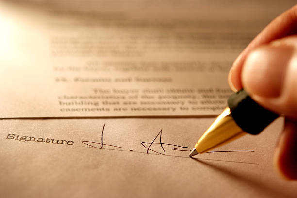 istock Sepia toned Image of signing a contract with light rays 171154323
