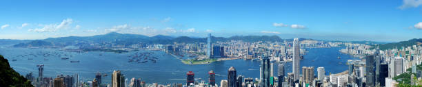 Panoramic view of Hong Kong at day http://www.istockphoto.com//file_thumbview_approve/13873130/2/istockphoto_13873130-hong-kong-victoria-harbor-at-day.jpg international commerce center stock pictures, royalty-free photos & images