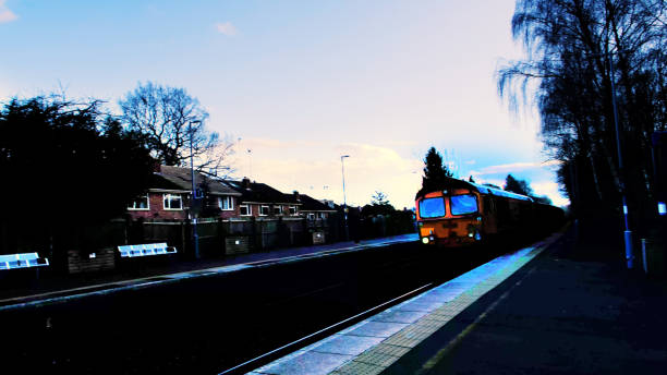 istock A freightliner locomotive is pulling a goods / freight train with containers. 1711545056