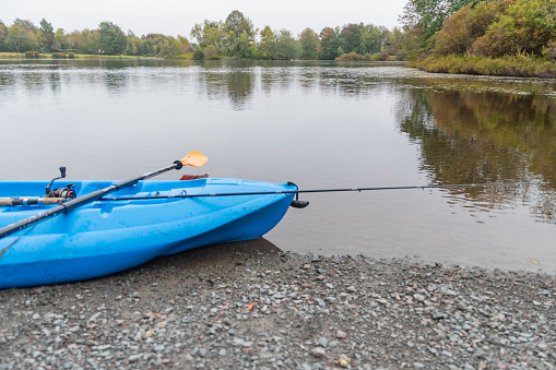 Autumn lake kayak fishing