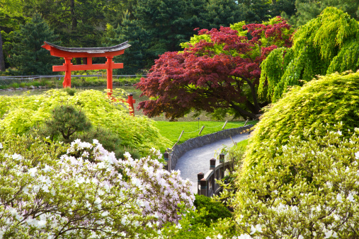 Chinese garden: arch gateway to bridge, photographed in a free public park named Xiyuan,  Yangzhou city, China.