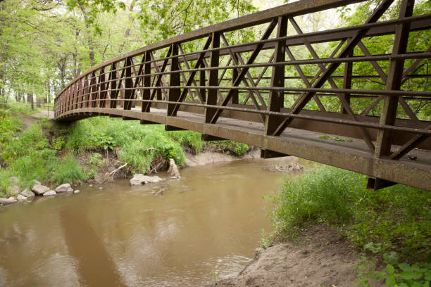istock steel foot bridge over river 171155689