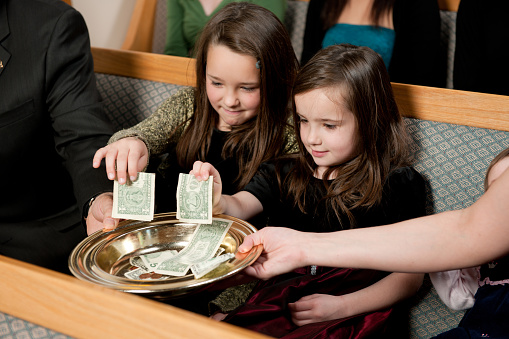 Tithes and offering during a church service - Buy credits
