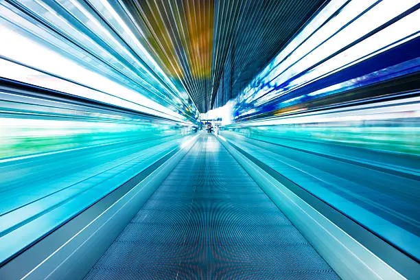 Photo of Abstract View of Moving Walkway in Airport Corridor