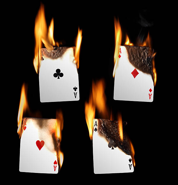 Burning Playing Cards - Aces stock photo