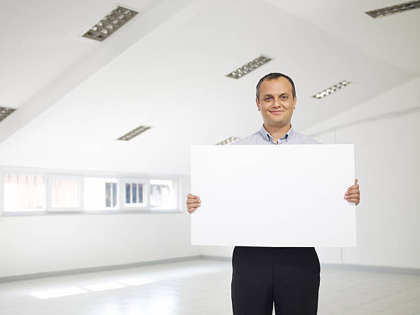 istock Mature Businessman Holding A Billboard 171156277
