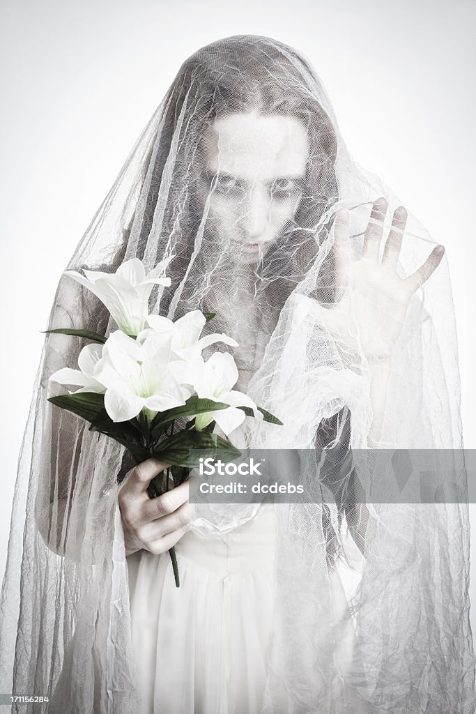 Corpse Bride A ghostly bride holding flowers. Bride Stock Photo