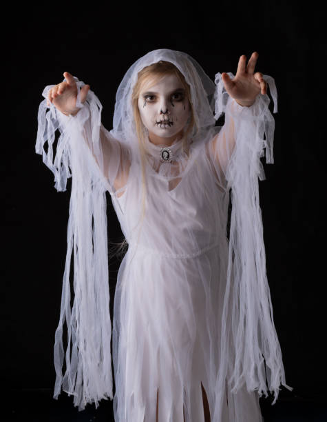 istock Girl in Halloween ghost costume 1711564215