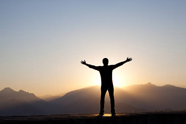 istock Man Worshipping at Sunrise 171156691