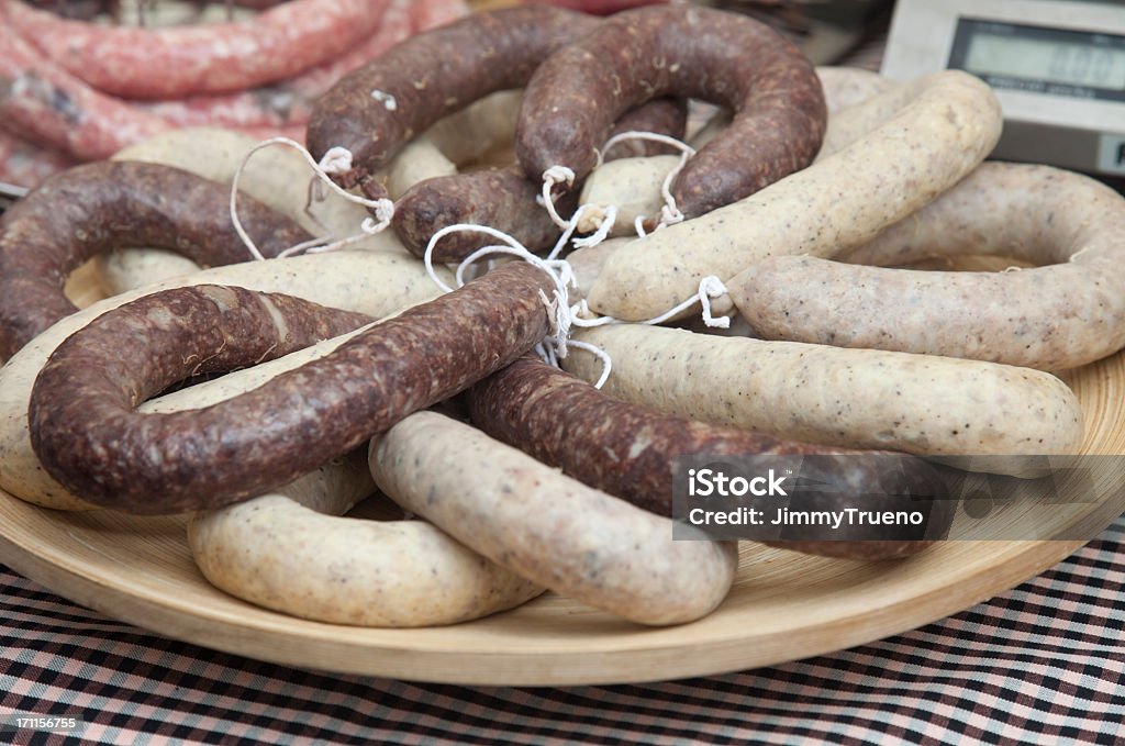 Botifarra catalana, catalan sausage Black sausage and white sausage, one of the most important dishes of the Catalan cuisine. Made with pork's meat and (the black one) pork's blood as well. Can be eaten raw or fried. Abundance Stock Photo