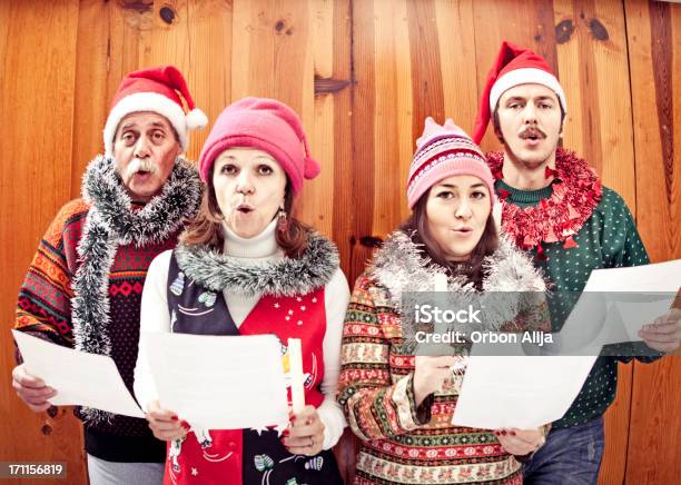 Family Singing Christmas Songs Stock Photo - Download Image Now - Caroler, Christmas, Choir