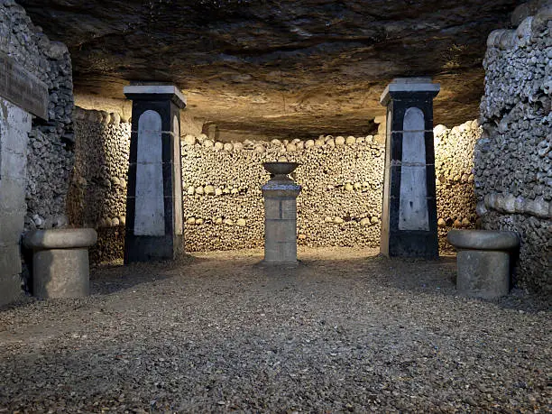In 1785, Paris decided to solve the problem of its overflowing cemeteries by exhuming the bones of the buried and relocating them to the tunnels of several disused quarries, which were consecrated as a cemetery. It is estimated that about one million bodies are buried here. Paris, France.