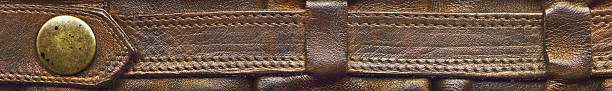 hi-res viejo grunge de ternera cinturón de cuero con botones de latón detalles - leather belt sewing hide fotografías e imágenes de stock