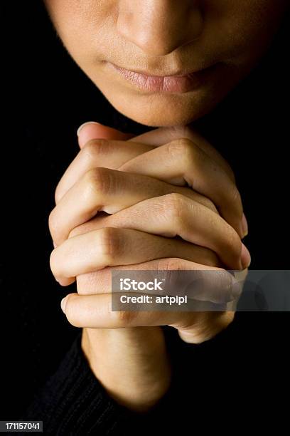 Woman Praying With Hands Closed In The Dark Stock Photo - Download Image Now - Forgiveness, Adult, Adults Only