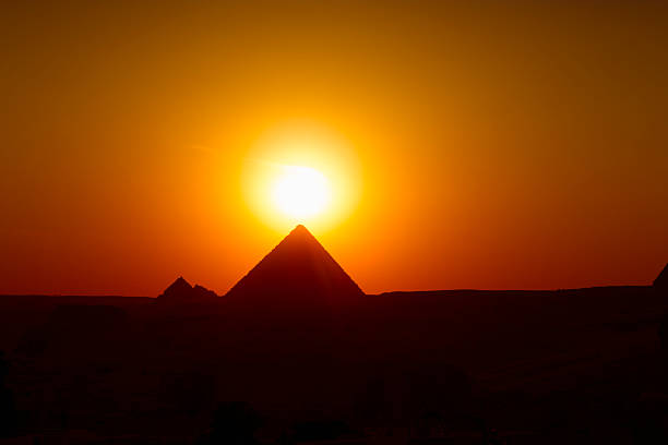 sunset over Gizeh Sunset over the great pyramids of Gizeh, Egypt pharaoh photos stock pictures, royalty-free photos & images