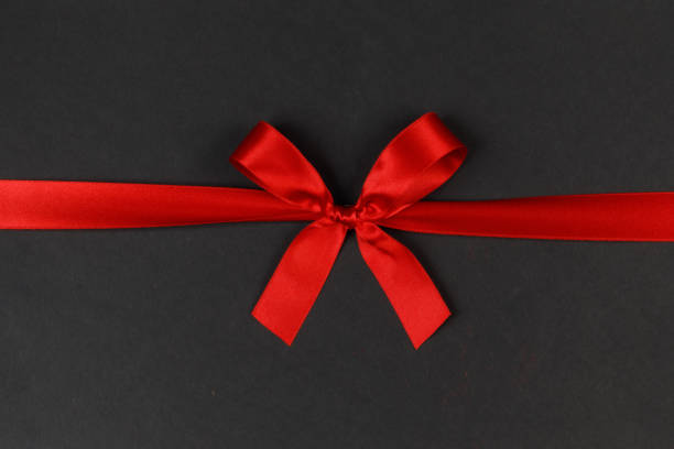 istock Shiny red satin ribbon bow 1711573743