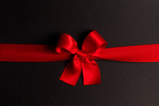 istock Shiny red satin ribbon bow 1711573773
