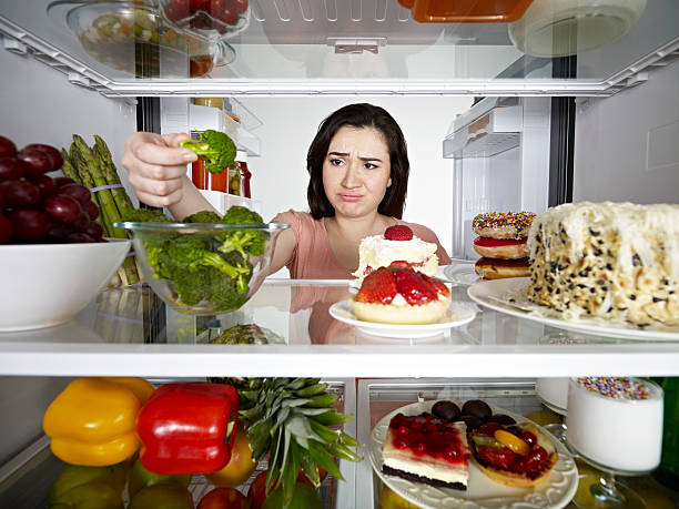 istock Woman Taking Broccoli From Fridge 171159063