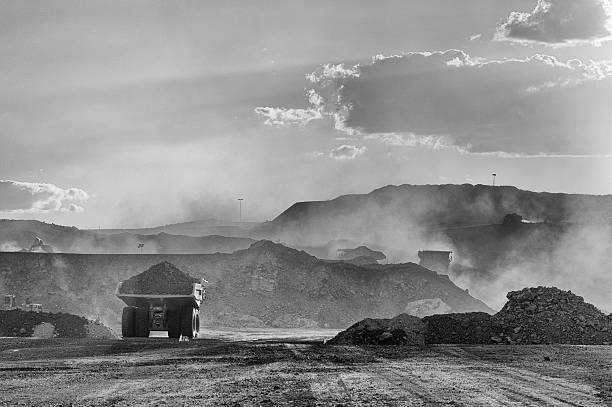 Coal Mining Truck on Haul Road Trucks on mine haul road. coal mine photos stock pictures, royalty-free photos & images