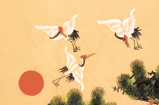 Chinese traditional ink painting of crane birds on yellow paper.