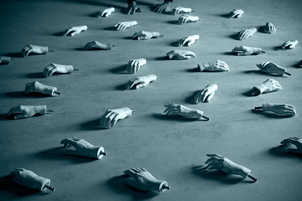 Mannequin's hands on the floor, toned image.