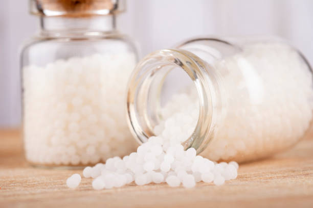 istock Homeopathy globules in glas bottles on a table 1711597751