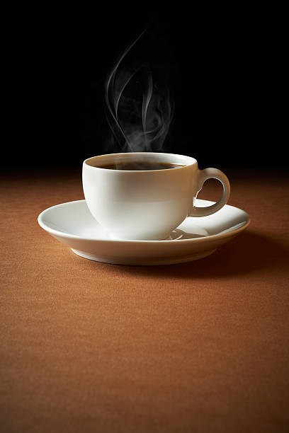 istock White cup of coffee sends up steam 171160107