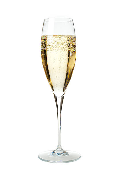 Glass of Champagne To properly welcome the New Year's Eve what's better than a flûte of sparkling and chilled French Champagne? Vertical portrait of a flûte glass full of champagne isolated on white, ideal for conveying any party related concept. champagne flute stock pictures, royalty-free photos & images