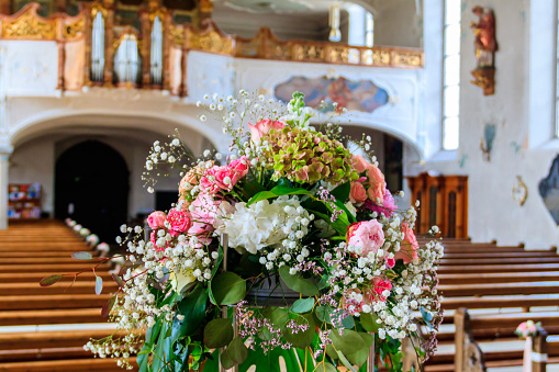 Close-up of a beautiful flower wedding decoration in church