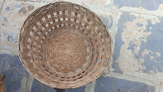In India it is made of plaited willow tree branches, it is called kodi jalla or kodi butta in Indian language and it is used to cover chicken coops at night.