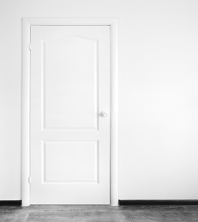 white interior with closed door