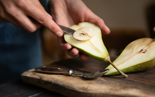Woman preparing poached pears