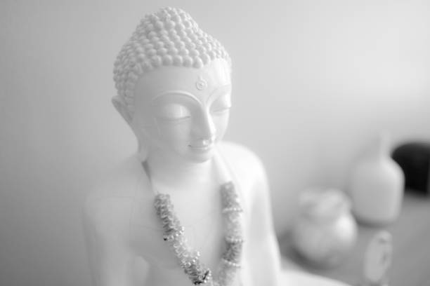 close up face on buddha head statue with Bokeh background and lighting effect.      Selective focus face buddha statue.