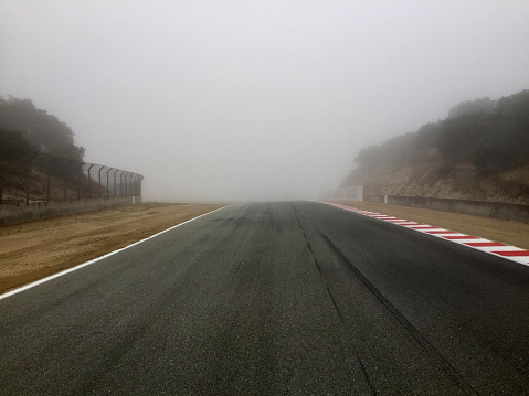 Very foggy race track. Vehicle racing circuit. Motorsport, competitions.