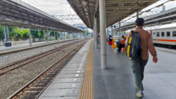 istock A man is walking at a train station with a blurred train in the background 1711691039